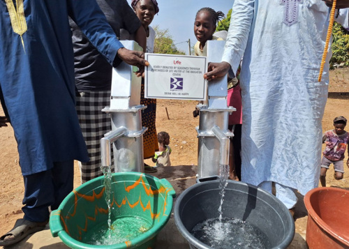 Villager getting clean water from a tap